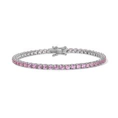 Enhance your jewelry collection with the captivating beauty of our Pink Sapphire Tennis Bracelet. Adorned with vivid pink gemstones, this exquisite piece radiates elegance and charm. Available in 14K Yellow Gold and White Gold Carat weights are reflective of a 7in bracelet. Shorter lengths will have lower carat weights that those listed. Gemstones are natural, therefore colors may vary Classic Pink Tennis Bracelet With Jubilee Style, Classic Pink Tennis Bracelet With Jubilee Design, Pink Jubilee Tennis Bracelet In Classic Style, Classic Pink Tennis Bracelet, Pink Tennis Bracelet With 17 Jewels For Wedding, Pink Diamond Bracelet For Wedding, Luxury Pink Diamond Bracelet For Anniversary, Elegant Pink Sterling Silver Round Bracelet, Elegant Pink Sapphire Bracelets