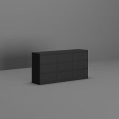 a black dresser sitting on top of a gray floor