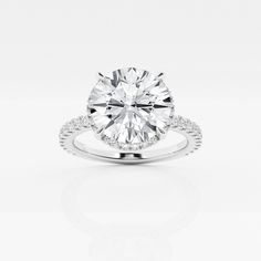 a round cut diamond ring with pave set shoulders