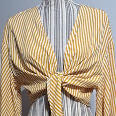 Shein Yellow And White Stripped Tie Front Cropped Blouse Or Cover Up With 3/4 Butterfly Sleeves Size Large. This Blouse Flatters A Woman's Bust And Midsection When Worn By Itself, Showing Some Skin Its Light Weight And Flowy Material Makes It Great For A Summer Time Cover-Up As Well. It Is New Without Tags As It Came Without Any Tags Attached. Striped Long Sleeve Summer Blouse, Fitted Striped Blouse For Beach, Fitted Striped Blouse For The Beach, Striped V-neck Top For Daywear, Summer Striped Tops For Brunch, Striped V-neck Blouse For Daywear, Yellow Long Sleeve Summer Blouse, Striped Blouse For Summer Brunch, Fitted Striped Blouse For Vacation