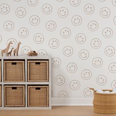 the wallpaper in this nursery room is decorated with smiley faces, stars and circles