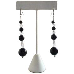 1920s pierced black dangling earrings. Made from smooth, round, Persian black Onyx beads and faceted crystal roundels. Strung on a fine sterling silver chain. The original wires have been replaced with modern sterling silver fittings. See the matching necklace we have listed. 65 x 13 mm widest bead.  Love it ♡  Get it ☆  Get Lucky 💋 Vintage Elegant Black Chandelier Earrings With Dangling Beads, Black Faceted Beads Dangle Jewelry, Black Crystal Jewelry With Faceted Beads, Black Dangle Jewelry With Faceted Beads, Elegant Faceted Crystal Dangle Earrings, Evening Black Bead Drop Earrings, Elegant Black Beaded Crystal Jewelry, Classic Onyx Jewelry For Party, Elegant Black Bead Drop Earrings