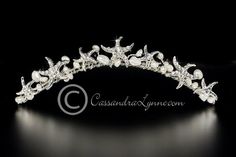 a tiara with pearls and stars on it