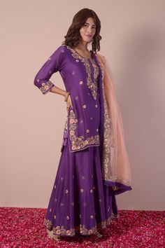 Purple kurta with gota patti, thread, sequin hand embroidery in floral butti pattern all over. Paired with sharara and contrast peach dupatta with embroidered border. - Aza Fashions Semi-stitched Purple Sharara With Resham Embroidery, Purple Salwar Kameez With Dori Work For Diwali, Semi-stitched Purple Sharara With Dori Work, Semi-stitched Purple Kurta With Dori Work, Purple Semi-stitched Sharara With Dori Work, Festive Dola Silk Palazzo Set With Zari Work, Purple Semi-stitched Sharara With Resham Embroidery, Purple Resham Embroidered Salwar Kameez In Chinon, Purple Salwar Kameez With Zari Work In Chinon