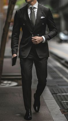 Elevate your style with a black pinstripe suit, a timeless symbol of sophistication and professionalism. Perfect for business or formal events. #BlackPinstripeSuit #MensFashion #ClassicStyle #ElegantAttire #TimelessFashion Business Professional Outfits Men Suits, Classic Pinstripe Suit, Pinstripe Suits Men, Dance Macabre, Men Suits Black, Usa Dress, Suit Combinations, Matric Dance