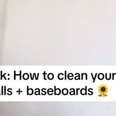 a person holding up a sign that says ask how to clean your walls and baseboards