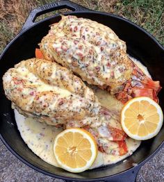 chicken with lemons and sauce in a skillet