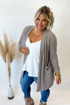 Our popular thumbhole popcorn cardigan you guys have grown to love are now in Fall colors! While they are still meant to be a slight oversized fit, we have reeled in sizing just a bit so the One Size (4-12) doesn’t feel “too big”, and Plus OS (14-22+) is roomy across the shoulders/hips and arms but not TOO long in the arms! If you border a size on either end of the size chart, size up or down MADE IN: USA Model is size 16/18 FIT: RELAXED FABRIC: 77 POLY 22 RAYON 1 SPAN SIZING XS/S (petite): 0-2 Bubble Waffle, Fall Cardigan, Fall Cardigans, Waffle Fabric, Rose Boutique, Pocket Cardigan, Floral Jacket, Denim And Lace, Lightweight Cardigan