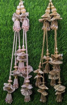 Indian Handmade Beaded Lahenga Latkan Tassels for Saree HandBags Hangings Dupatta Bridal Wedding dress for Women pair of 2 pcs Size - 32 cm Length  Item Description You can use this Beautiful pair of tassle for several DIY projects.  *These beautiful Tassel Latkans are used as the accessory for Lahenga and saree , but u can use according to your need and your innovative ideas. * Package contains 2 Latkan / 1 Pair you can use these latkans in various ways Craft Projects Designing Home Decoration Festive celebrations. Evening and party Apparels. Home décor items Apparel & Fashion Scarves n Stoles Headband, hats Table cover, curtains, Pillow covers, Cushion cover Shoe designing Headband, hats Table cover, curtains Designing stylish blouses Ship From New Delhi, India 2 Latkan / 1 Pair Luxury Bollywood Jewelry With Latkans, Luxury Traditional Danglers With Latkans, Affordable Wedding Chandbalis With Latkans, Luxury Chandbalis With Latkans As A Gift, Latkan Tassels Blouses Weddings, Luxury Saree With Latkans, Luxury Latkans Necklace For Wedding, Luxury Festive Chandelier Earrings With Latkans, Cheap Chandbalis With Latkans For Wedding