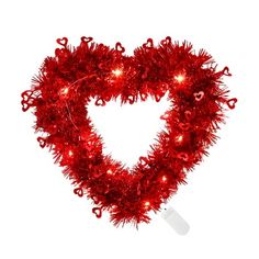 a red heart shaped garland with lights on it's sides and hearts in the middle