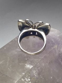 "Butterfly ring mother of pearl sterling silver women girls Size 6.75. Between a size 6.75 and a size 7 Length 7/8\" Width 1\" Thinnest 5/32\" Free Shipping & Free Postal Insurance Delivered in a Gift Box If you do not want the ring polished and want to leave the natural patina please let me know at the time of purchase as I do polish rings before I ship rings out. Thanks Free First Class shipping and postal insurance is included. If you want to upgrade to priority kindly pay an additional f Silver Sterling Silver Pearl Ring With Polished Finish, Stamped 925 Rings For Mother's Day Wedding, Adjustable Butterfly Ring Fine Jewelry, Silver Ring For Formal Occasions And Mother's Day, Silver Ring For Formal Occasions On Mother's Day, Classic Adjustable Silver Crystal Ring, Classic Silver Butterfly Ring For Anniversary, Nickel-free Ring For Mother's Day, Adjustable Fine Jewelry Opal Ring