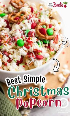 a bowl filled with christmas popcorn and pretzels