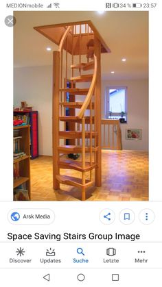 a wooden spiral staircase in the middle of a room