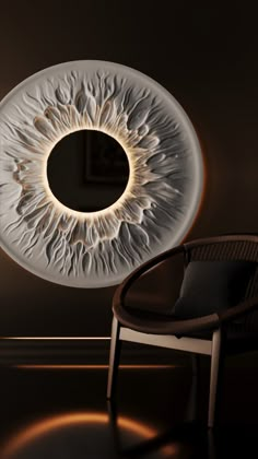 a chair sitting in front of a large circular light fixture on the side of a wall