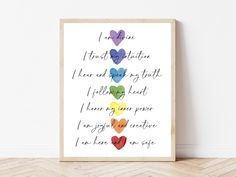 a framed poster with the words i love you and hearts on it in different colors