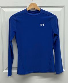 Pre-owned Youth Boys Under Armour Fitted Long Sleeve Athletic Shirt Size: Large Material: 88% Polyester, 12% Elastane Color: Blue with white logos Style#: 1202691 Note: There may be some variations in color in the photos vs. actual item due to camera and lighting. Product Details: Heat Gear Fitted Pullover  Machine wash Approximate measurements when laid flat: 15.5” inches across, armpit to armpit 23” inches long, measured from top of shoulder to bottom hem 4.25” inch wrist opening, measured fla Long Sleeve Athletic Shirt, Fitted Long Sleeve, Athletic Shirts, Fashion Logo, Under Armour, Royal Blue, Long Sleeve Tshirt Men, Color Blue, Mens Tshirts