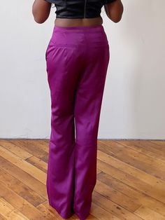 Why You'll Love It     Lightweight, unlined, and feminine wide-leg trousers feature functional pockets, a belt loop, and a tapered finish   Fit : Tapered. There is no stretch, so order your appropriate pants size/jean size when it comes to these pants.   Fabric : 95% Polyester, 5% Spandex   Care : Hand Wash Cold, Do not bleach, line dry, iron low heat    Model Specs:      Bust:  33"   Waist:  28"   Hips:  37"   Height:  5'4  Model is wearing a size MEDIUM    Size Guide:    Fit:    Fitted, there Silk Wide Leg Pants For Evening, Silk High-waisted Wide Leg Pants For Party, Silk Wide Leg Pants Full Length, Silk Evening Pants, Elegant Full-length Purple Bottoms, Elegant Full Length Purple Bottoms, Elegant Purple Pants For Party, Fitted Silk Straight Leg Pants, Sleek Satin Wide Leg Pants For Formal Occasions