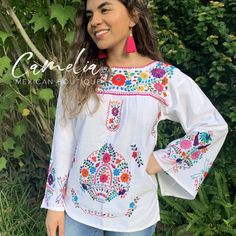 Full frontal embroidery Puebla Mexican Blouse with fine embroidery on 100% cotton muslin (manta) fabric. Unique Bell Sleeve with embroidery all around makes this Mexican blouse unique. Shop our entire Puebla Collection here. SIZE CHART: Runs Small td {border: 1px solid #ccc;}br {mso-data-placement:same-cell;} BELL SLEEVE MEXICAN BLOUSE WIDTH (underarm to underarm) BUST LENGTH (from shoulder) SLEEVE LENGTH (from underarm) SM 16" 32" 25" 18" MED 18" 36" 27" 29" LG 19" 38" 27.5" 20" approximate mea Traditional White Top With Geometric Embroidery, Traditional White Embroidered Top With Geometric Pattern, Traditional White Embroidered Top With Geometric Embroidery, White Peasant Top With Geometric Embroidery, White Cotton Peasant Top With Embroidered Sleeves, White Folk Style Embroidered Top With Resham Embroidery, White Folk Style Top With Resham Embroidery, Traditional White Blouse With Geometric Embroidery, White Cotton Peasant Top With Intricate Embroidery