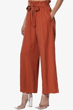 Upgrade your look with chic culotte pants, styled with an detachable tie belt and elastic paperbag waist. A high-waist hits just right and falls into a wide leg crop fit. Pair these with the Crop Top for full effect.Tencel woven, high rise with paperbag pleats, Pull onElasticized waist, Detachable sash tie beltWide leg, cropped length, side slant pocketsSize Guide : Fits true to size, take your normal size(S=1-3, M=5-7, L=9-11)Model size : 5'3" height, 34" bust, 24" waist, 34" hip, Normally wear Casual Wide-leg Pants With Belted Cuffs, Fall Paperbag Waist Pants With Elastic Waistband, Fall Paperbag Waist Pants With Elastic Band, Casual Belted Wide Leg Pants For Fall, Versatile Belted Bottoms For Spring, Spring Wide Leg Ankle-length Pants With Tie Waist, Casual High-waisted Pants With Belted Cuffs, Relaxed Fit Wide Leg Pants With Tie Waist, Solid Wide Leg Pants For Daywear