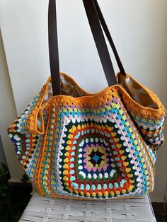 Crochet Tote Large Bag, weekend bag,Granny square Bag, Colorful Vintage Bag , XL Çanta,Retro Bag,Hippie bag, Gift for Women,Boho Bag  The size of the bag is 65*35 cm *100% handmade *There is a pocket inside Bag color may vary slightly due to different monitor settings. The pattern and color of the lining inside the bag may vary. There may be different orders in motif colors. If you have any questions, please don't hesitate to contact me. You can browse my other items in my store. Everyday Multicolor Square Hobo Bag, Bohemian Multicolor Everyday Bags, Everyday Multicolor Bohemian Bags, Multicolor Bohemian Everyday Bags, Multicolor Square Hobo Bag For Travel, Everyday Bohemian Multicolor Bags, Handmade Multicolor Hobo Bag For Everyday, Bohemian Granny Square Bags For Everyday, Everyday Multicolor Handmade Hobo Bag