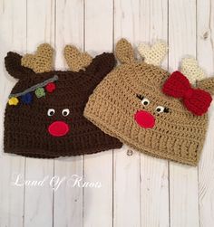 two crocheted hats with reindeer faces on them, one is brown and the other is red