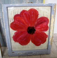 an image of a red flower painted on a piece of paper with the words window construction below it