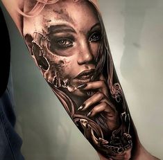 a woman's face and skull tattoo on the arm