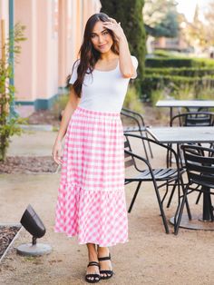 Hey there fashionista! Are you tired of wearing the same old jeans every day? It's time to switch things up and embrace the comfort and style of skirts! And we've got just the perfect one for you - the Gingham Midi Skirt in Pink. This skirt is not only trendy but also super comfortable. You can easily layer it with a tee, a jean jacket, and sandals for a chic spring outfit that feels as comfy as your favorite sweats. With sizes ranging from Small to XL, you can find the perfect fit for you. Our model, who is 5'5" and wears a size 2/4, looks stunning in a small. So why settle for boring jeans when you can rock this adorable Gingham Midi Skirt? Add it to your cart now and get ready to turn heads with your fashion-forward style! Size: Small 0-4 Medium 6-8 Large 10-12 XL 12-14 Gingham Skirt For Day Out In Spring, Casual Gingham Mini Skirt, Casual Gingham Skirt For Summer, Spring Gingham Skirt For Day Out, Casual Summer Gingham Skirt, Casual Plaid Skirt For Spring, Casual Fitted Skirt For Picnic, Trendy Gingham Skirt For Spring, Summer Lined Plaid Skirt