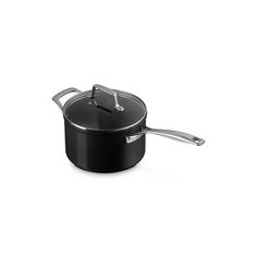 a black pot with a lid and handle on a white background for use in cooking