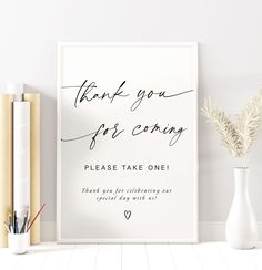 a white poster with the words thank you for coming on it next to some books