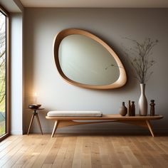 a wooden bench sitting in front of a round mirror on the side of a wall