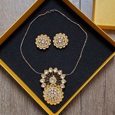 This Necklace Set Has A Statement-Making Centerpiece By Yuva For Neeru's, An Indian Women's Clothing And Accessories Boutique. It Has A Youthful Radiance And Exudes A Queenly Design. It Is Crafted With Cz Stones And Polished With An Antique Plating Which Makes Sure That Your Favorite Piece Lasts A Long Time And Continues To Bring You Admiration From Everyone. Brand New And Still In The Box. Never Worn. Kundan Necklace With Matching Earrings As Gift, Gold Kundan Round Pendant Necklace Gift, Gold Necklaces With Matching Earrings And Round Pendant, Gold Kundan Necklace For Gift, Costume Jewelry, Gold Kundan Necklace Costume Jewelry For Gift, Gold Kundan Necklace Costume Jewelry As Gift, Silver Kundan Necklace Set As Gift, Silver Kundan Necklace With Matching Earrings As Gift, Round Metal Kundan Necklace For Gift