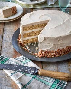 there is a cake that has been cut and served on a plate with a knife