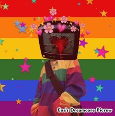 a person wearing a rainbow colored sweater and holding a black bag with flowers on it