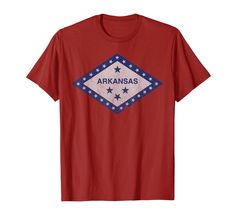 a red shirt with the word arkans on it and stars in blue, white, and