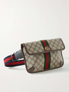 Gucci's 'Ophidia' belt bag has been crafted in Italy from monogrammed coated-canvas in classic shades of brown. Detailed with a gold emblem, it's trimmed with durable full-grain leather and signature striped webbing. Designer Travel Bag With Removable Belt, Luxury Travel Belt Bag With Dust Bag Included, Luxury Coated Canvas Belt Bag For Everyday, Luxury Rectangular Belt Bag For Travel, Designer Belt Bag With Removable Belt For Everyday Use, Luxury Shoulder Bag With Logo Strap In Coated Canvas, Luxury Belt Bag With Removable Pouch In Coated Canvas, Classic Monogram Canvas Belt Bag With Removable Pouch, Designer Belt Bag With Gold-tone Hardware For Travel