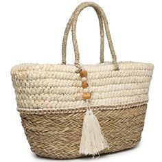 This Bag Is A Lovely, Two-Tone Tote Made Of Natural Seagrass. It Features Metallic Thread Woven Through It As Well As A Wood-Trimmed Tassel. The Inside Is Lined With A Zip Pocket To Carry Your Most Important Belongings! Natural Two-Tone Seagrass Tote Soft Rope Handle Wood Tassel Trim Dimension: 21"L X 12"H X 9"D Weight: 2.5 Lbs Cream Basket Bag With Braided Handles, Cream Basket Bag For Travel, Cream Basket Bag For Shopping, White Jute Bag With Leather Handles, White Large Capacity Jute Beach Bag, White Woven Jute Bag, White Jute Rectangular Shoulder Bag, White Jute Bags With Leather Handles, White Jute Bags For Daily Use