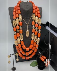 This three  tier coral set embellished with gold crystals & accents is a must! Made for that high and low curated neck. we ensure that all of our jewelry is expertly handmade with attention to detail, so you can be assured of the highest quality design. Your satisfaction is our top priority; we provide excellent customer service and offer fast shipping. Red Coral Jewelry With Gold Beads, Traditional Orange Faceted Beads, Gold Beaded Necklaces With Red Coral Round Beads, Gold Beaded Red Coral Necklaces, Elegant Orange Beaded Necklaces With Spacer Beads, Traditional Orange Beaded Necklace With Gold Beads, Gold Beaded Necklace With Polished Red Coral, Elegant Orange Beaded Necklace With Spacer Beads, Elegant Coral Jewelry With Gold Beads