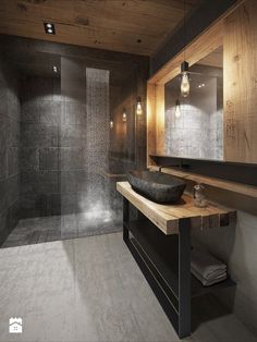 a bathroom with a sink, mirror and shower stall in the middle of the room