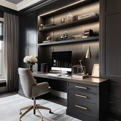 a home office with dark wood cabinets and white carpeted flooring, along with a large window