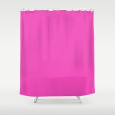 a bright pink shower curtain with white trim