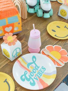 colorful plates and napkins are laid out on the table for children's birthday party