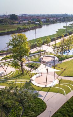 an aerial view of a park with trees and water