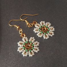 These bridgerton daisy earrings are wonderful gift to yourself or to your loved one.The victorian earrings are totally handmade,handwoven by me,in a smoke and pet free environment. Measurements: The height of the earrings are (2 cm.) 0.80 inches. SHIPPING: I will send all orders with Express Shipping.(Fedex,TNT or UPS)Express delivery in 4-6 days. Your earrings are one of a kind. Your earrings will come in a gift package. If you have any questions or any concerns,please do not hesitate to contac Bridgerton Inspired Crafts, Daisy Earrings, Victorian Jewelry, Jewelry Projects, Handmade Bracelets, Beaded Earrings, Mother's Day Gifts, Etsy Gifts, Gifts For Women