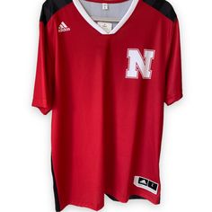 Rare Nebraska Huskers Jersey. L Size. 100% Polyester. Made In Thailand. Red Sporty V-neck T-shirt, Red Sporty Tops For College, Sporty Red Tops For College, Red Varsity Sports Top, Adidas Sporty V-neck Tops, Casual Red Tops For Game Day, Red V-neck Sporty T-shirt, Casual Red T-shirt For Sports Season, Casual Red Sports Tops