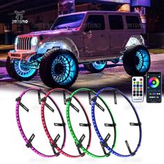 four different color changing leds on the front of a jeep with remote controls and accessories