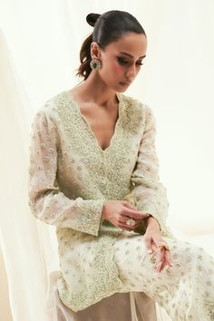 Ice mint jacket with pearls and sequins embroidery in geometric pattern. Paired with an embroidered bell bottom pant. - Aza Fashions Festive Long Sleeve Palazzo Set With Pearl Embroidery, Elegant V-neck Palazzo Set For Festive Occasions, Long Sleeve Georgette Sets With Pearl Embroidery, Bollywood Embellished Long Sleeve Palazzo Set, White Semi-stitched Sets With Pearl Embroidery, Elegant Embroidered V-neck Palazzo Set, Luxury Hand-embellished Long Sleeve Palazzo Set, Semi-stitched Long Sleeve Palazzo Set With Intricate Embroidery, Mint Jacket