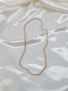 Our 18k Gold Filled Rope Chain Necklace is the perfect layering piece to accentuate any style. This lightweight rope chain pairs beautifully with other chain necklaces or pendants--We love it with our Anabella Necklace. This essential necklace is a must-have for every fashion lover! Details 18k Gold Filled 18in 20in, 22in in Length 2.5mm width model wearing 20in Tarnish-resistant, water-resistant, and safe for sensitive skin Gold Rope Chain Necklace With Figaro Style, Minimalist Gold Rope Chain Necklace With Adjustable Chain, Long Figaro Chain Necklace As Gift, Figaro Chain Long Necklace As Gift, Everyday Gold Rope Chain Necklace With Delicate Chain, Dainty Gold Rope Chain Necklace With Delicate Chain, Elegant Rope Chain Necklace For Everyday, Dainty Gold Rope Chain Necklace, Elegant Everyday Delicate Rope Chain Necklace