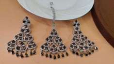 Black Kundan Maang Tikka and Jhumka Set | Tikka and Earring Set |  CZ AD black earrings mangtika - Free Delivery Making Time 10-15 Days In Personal trust me this is so much beautiful and in great quality nath, video call also available too see our products. These Celebrity Inspired Jhumka Earrings Are A Perfect Accessory This Wedding Season. Secured with a post and back Handcrafted To Perfection Perfect For Indian Weddings And Celebrations A Beautiful & Memorable Gift for Weddings and Special Occasions Fashion Empire Studio gives you new look, Made of high quality material(s).  This is very Designer Long Jhumki , Its A Choice Of Many Bollywood Celebrities.  Trust me, it is more Beautiful in Real another the Picture  This beautiful Set which is light in weight. The stones used are of high q Elegant Black Danglers With Latkans, Traditional Black Jewelry Sets For Festive Occasions, Black Temple Jewelry Sets For Wedding, Festive Black Jewelry Sets For Gifts, Black Festive Earrings, Traditional Black Jewelry Sets For Festivals, Black Chandbali Jewelry For Diwali, Traditional Black Earrings For Festive Occasions, Black Traditional Earrings For Festive Season