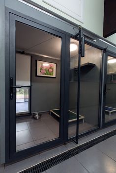 the inside of a building with glass doors